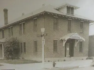 A black and white photo of an old building.