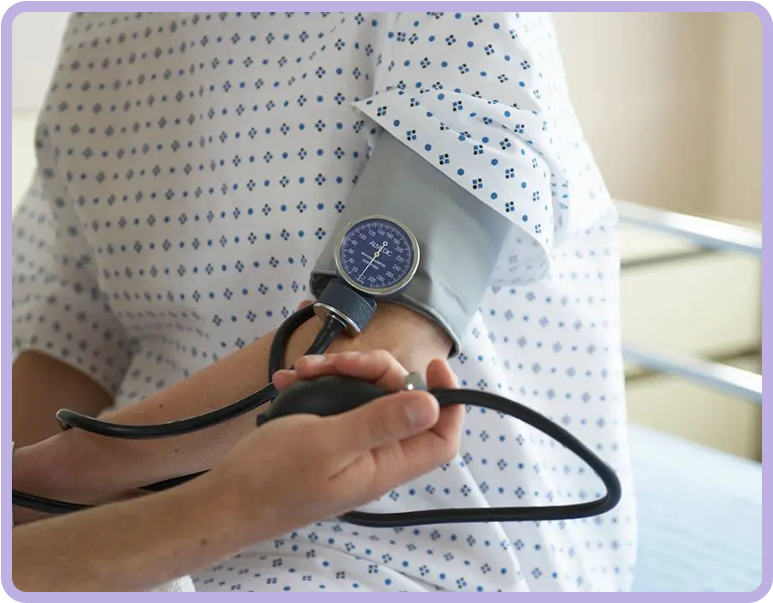 A person is holding a blood pressure monitor.